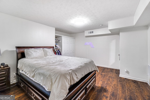 1029 Megan Ct, Sugar Hill, GA 30518 - bedroom featuring a closet, wood finished floors, baseboards, and a textured ceiling