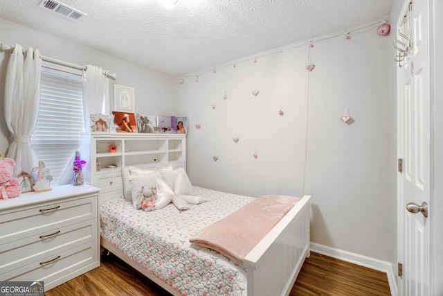 1029 Megan Ct, Sugar Hill, GA 30518 - bedroom with wood finished floors and a textured ceiling