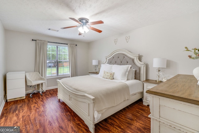 1029 Megan Ct, Sugar Hill, GA 30518 - bedroom featuring dark wood-type flooring, a ceiling fan, baseboards, and a textured ceiling