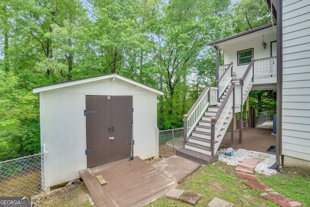 1029 Megan Ct, Sugar Hill, GA 30518 - view of shed featuring stairs, fence, and view of wooded area
