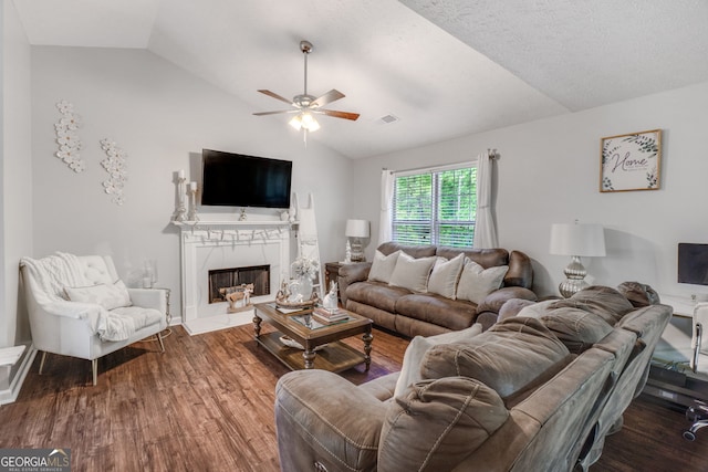 1029 Megan Ct, Sugar Hill, GA 30518 - living area with vaulted ceiling, a ceiling fan, wood finished floors, and a fireplace