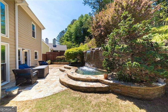 view of yard with fence and a patio area