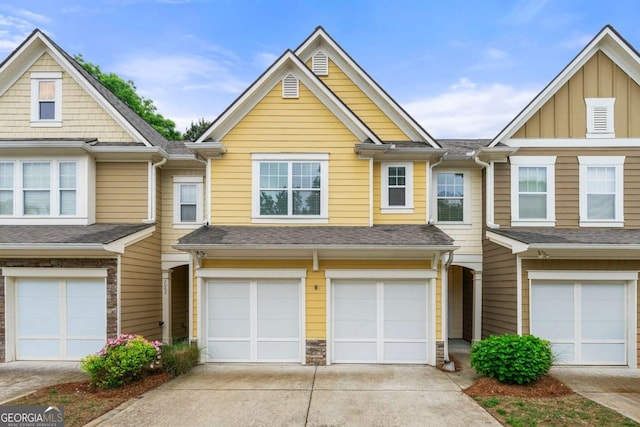 2060 Ellison Way NW Unit 11, Kennesaw, GA 30152 - view of property featuring an attached garage, driveway, and roof with shingles