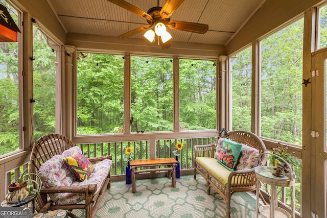 sunroom / solarium with ceiling fan and a healthy amount of sunlight