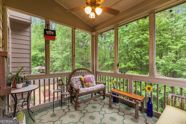 sunroom with a ceiling fan