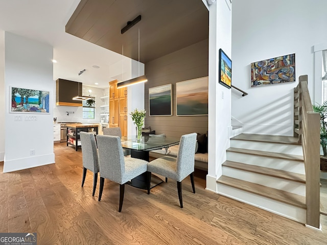 300 Mado Ln, Chattahoochee Hills, GA 30268 - dining room with wood finished floors, baseboards, and stairs