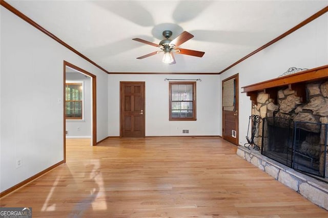 unfurnished living room featuring baseboards, ceiling fan, light wood finished floors, and crown molding
