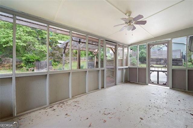 unfurnished sunroom featuring a ceiling fan