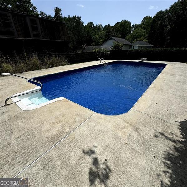 view of pool featuring a patio and a fenced in pool