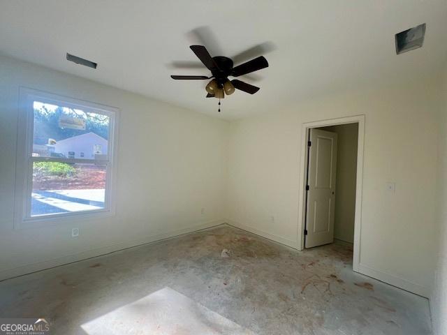 189 Warner Rd, Barnesville, GA 30204 - spare room featuring baseboards, a ceiling fan, and concrete flooring