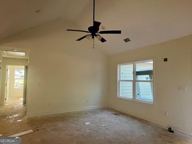 189 Warner Rd, Barnesville, GA 30204 - empty room featuring healthy amount of natural light, a ceiling fan, high vaulted ceiling, attic access, and baseboards