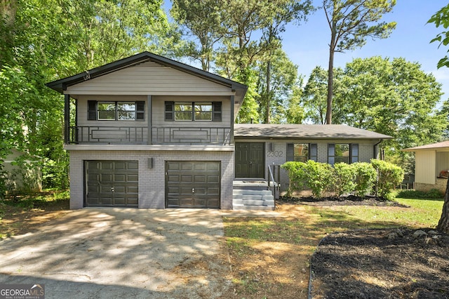 2302 Aurie Dr, Decatur, GA 30034 - tri-level home with brick siding, a garage, and concrete driveway