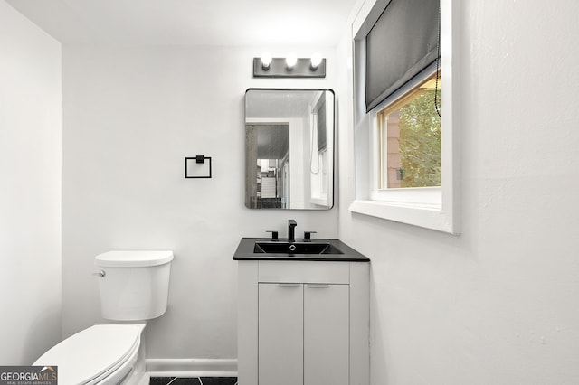 2302 Aurie Dr, Decatur, GA 30034 - bathroom featuring toilet, vanity, and baseboards