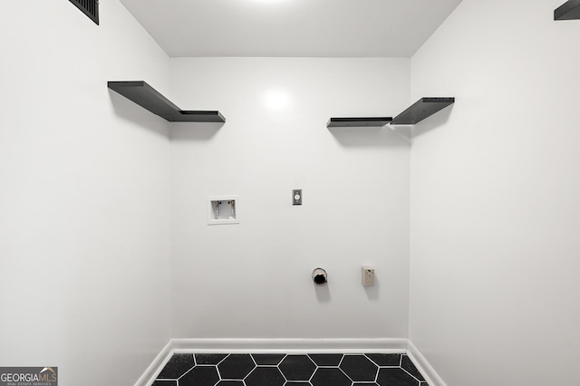 2302 Aurie Dr, Decatur, GA 30034 - washroom with hookup for a washing machine, hookup for an electric dryer, dark tile patterned flooring, and baseboards