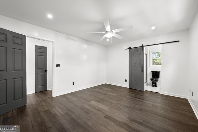 2302 Aurie Dr, Decatur, GA 30034 - empty room with a barn door, a ceiling fan, baseboards, dark wood-style flooring, and recessed lighting