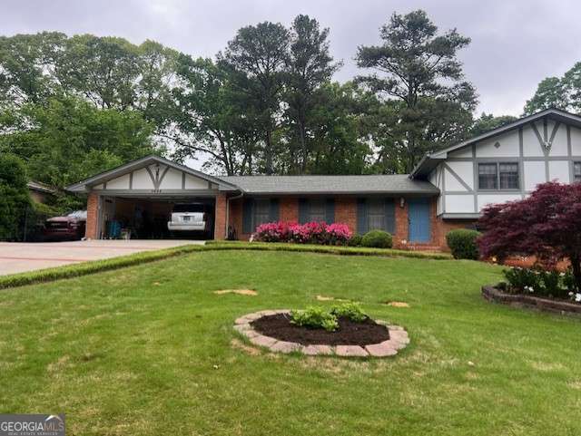 view of front of property with a front lawn, concrete driveway, and an attached garage