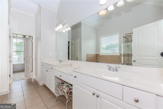 full bath with ornamental molding, a sink, tile patterned floors, and a healthy amount of sunlight
