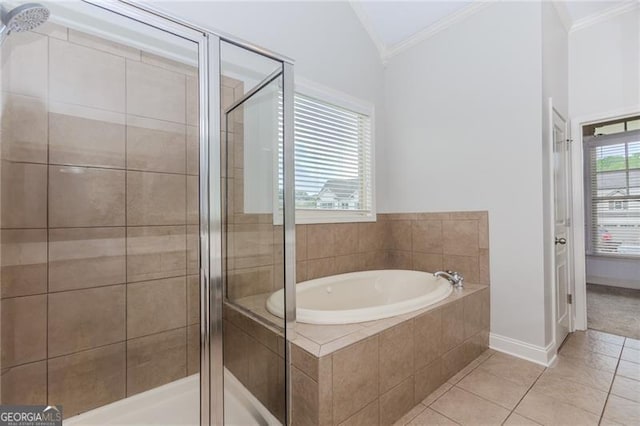 bathroom with a bath, a shower stall, crown molding, and vaulted ceiling