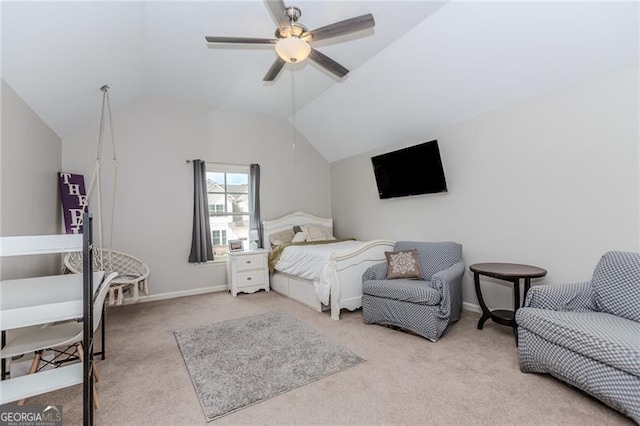 carpeted bedroom featuring baseboards, a ceiling fan, and vaulted ceiling