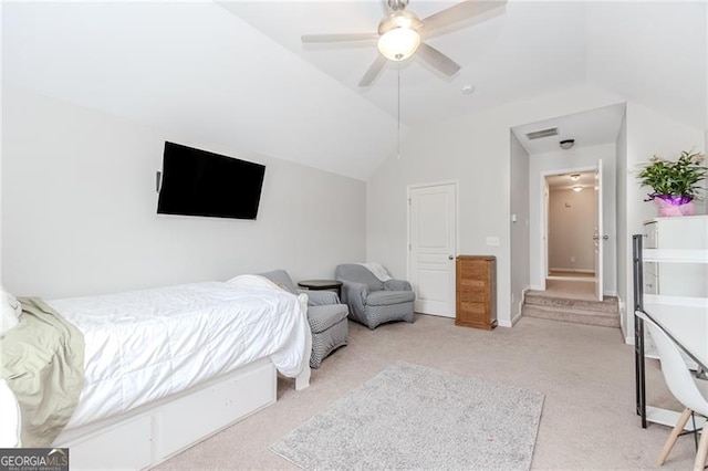 bedroom with visible vents, a ceiling fan, vaulted ceiling, and light carpet