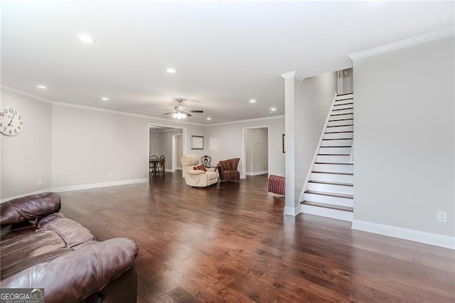 living area with stairway, ceiling fan, baseboards, recessed lighting, and wood finished floors
