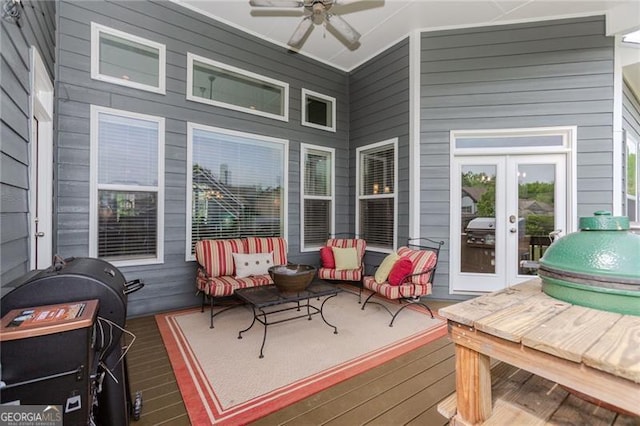 deck with ceiling fan, french doors, and an outdoor living space