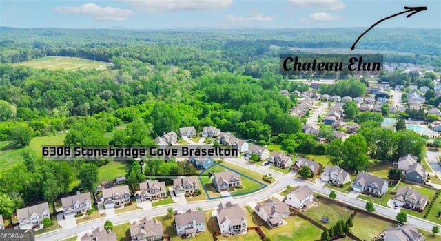 bird's eye view featuring a residential view and a view of trees
