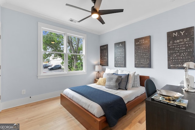 1671 Laurel Ave NW, Atlanta, GA 30318 - bedroom featuring visible vents, ornamental molding, wood finished floors, baseboards, and a ceiling fan