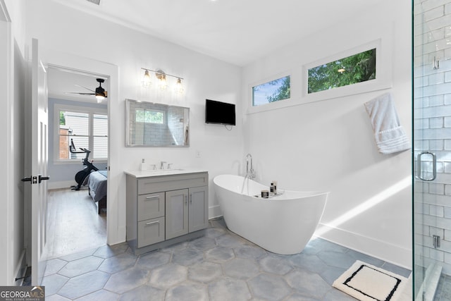 1671 Laurel Ave NW, Atlanta, GA 30318 - bathroom featuring ceiling fan, a stall shower, vanity, connected bathroom, and a soaking tub
