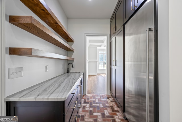 139 Thornhill Cir, Athens, GA 30607 - bar with a sink, built in refrigerator, and brick floor