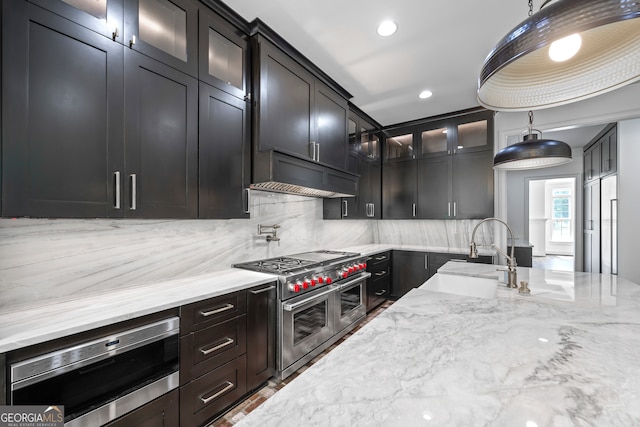 139 Thornhill Cir, Athens, GA 30607 - kitchen featuring backsplash, range hood, a sink, light stone counters, and stainless steel appliances
