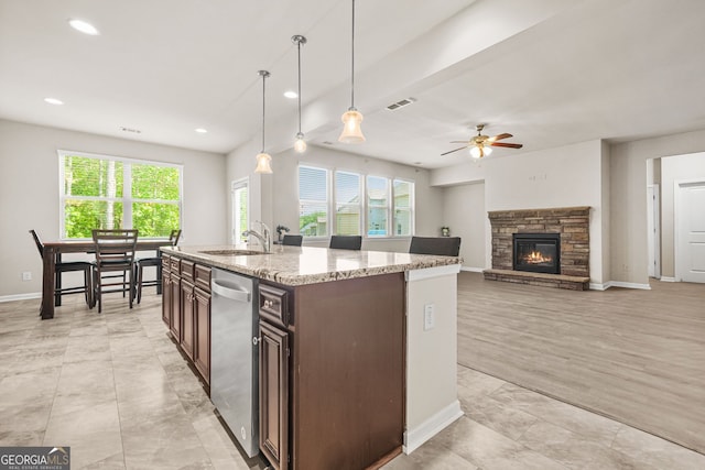 15 Manas Ct, Covington, GA 30016 - kitchen with stainless steel dishwasher, a sink, a healthy amount of sunlight, and visible vents