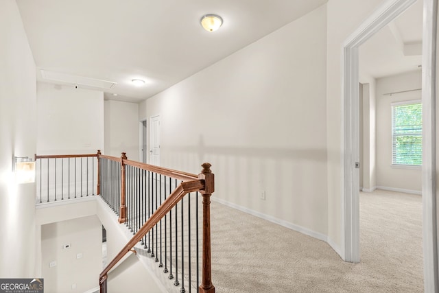 15 Manas Ct, Covington, GA 30016 - hallway with attic access, an upstairs landing, carpet flooring, and baseboards