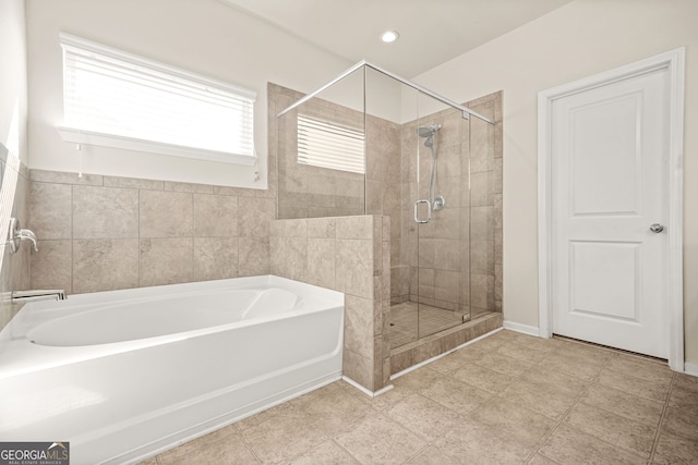 15 Manas Ct, Covington, GA 30016 - full bathroom featuring recessed lighting, a stall shower, and a garden tub