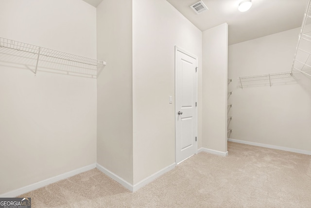15 Manas Ct, Covington, GA 30016 - walk in closet with visible vents and carpet floors