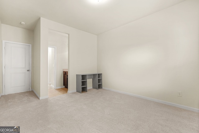 15 Manas Ct, Covington, GA 30016 - unfurnished bedroom with baseboards and light carpet