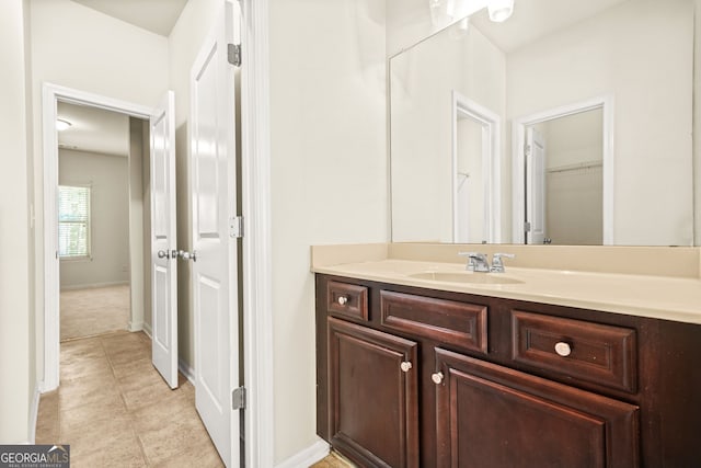 15 Manas Ct, Covington, GA 30016 - bathroom with tile patterned floors, vanity, and baseboards