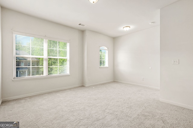15 Manas Ct, Covington, GA 30016 - unfurnished room featuring visible vents, baseboards, and carpet floors