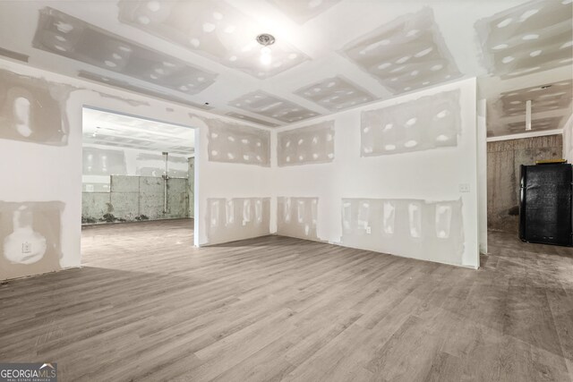15 Manas Ct, Covington, GA 30016 - unfurnished living room featuring wood finished floors