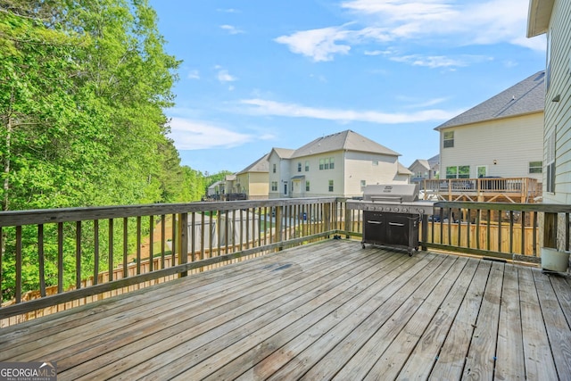 15 Manas Ct, Covington, GA 30016 - deck with a residential view and a grill
