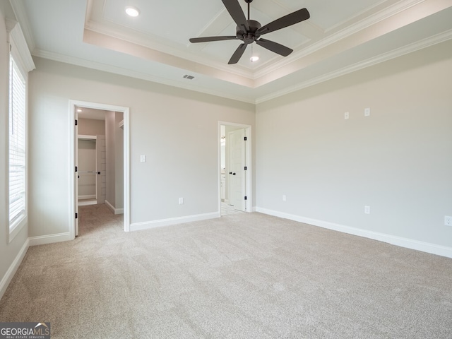 153 Lakeridge Dr, Adel, GA 31620 - unfurnished bedroom featuring crown molding, a spacious closet, light colored carpet, and baseboards