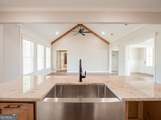 153 Lakeridge Dr, Adel, GA 31620 - kitchen with light stone countertops, ceiling fan, open floor plan, and a sink
