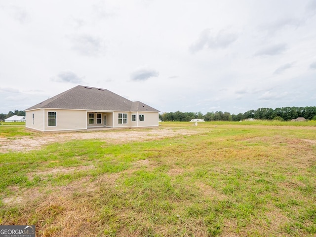 153 Lakeridge Dr, Adel, GA 31620 - back of house featuring a yard and french doors
