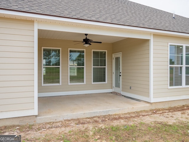 153 Lakeridge Dr, Adel, GA 31620 - doorway to property featuring a shingled roof, a ceiling fan, and a patio area