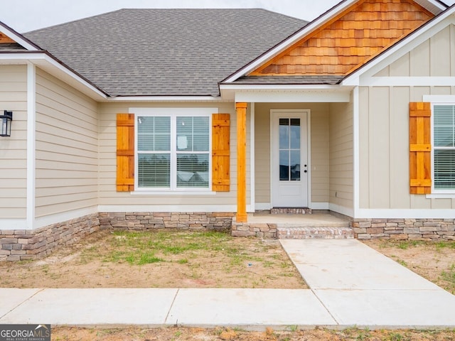 153 Lakeridge Dr, Adel, GA 31620 - view of exterior entry featuring board and batten siding and a shingled roof