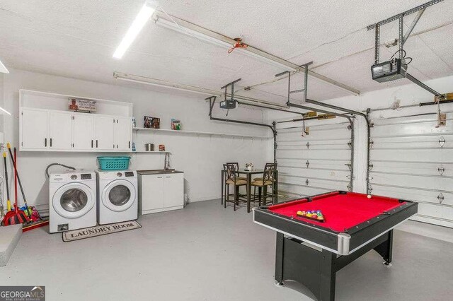 4393 Housworth Dr, Stonecrest, GA 30038 - playroom featuring finished concrete floors, washing machine and clothes dryer, a textured ceiling, and a garage