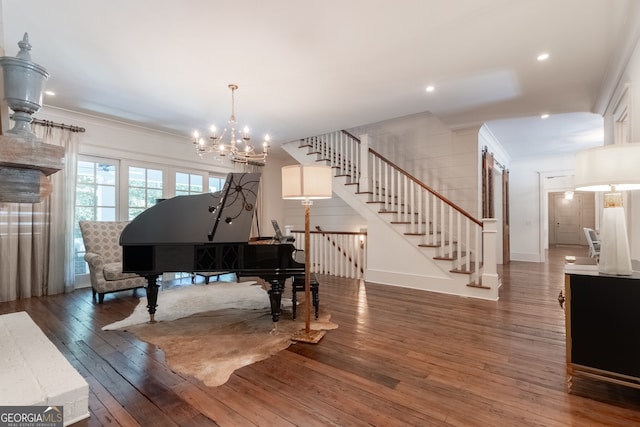 sitting room with recessed lighting, an inviting chandelier, stairway, wood-type flooring, and crown molding