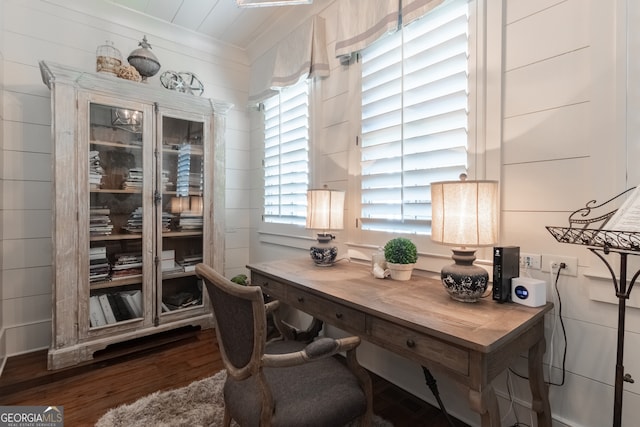 office area with wood finished floors and ornamental molding