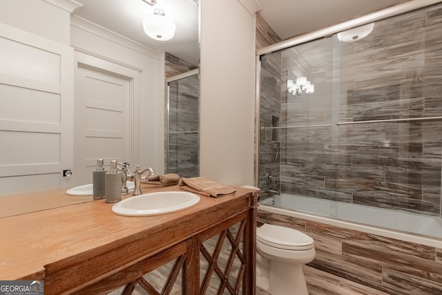 full bathroom featuring toilet, tiled shower / bath combo, and vanity