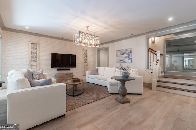living room with recessed lighting, stairway, wood finished floors, and a chandelier